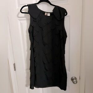 Large black scalloped mini dress
